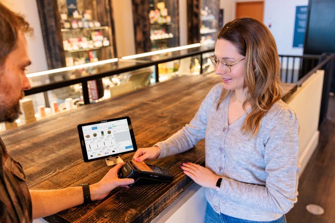 Customer paying at retail counter with tablet