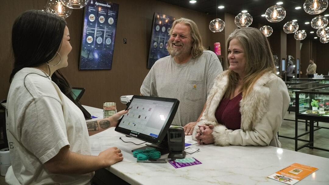 Customers at cannabis dispensary counter