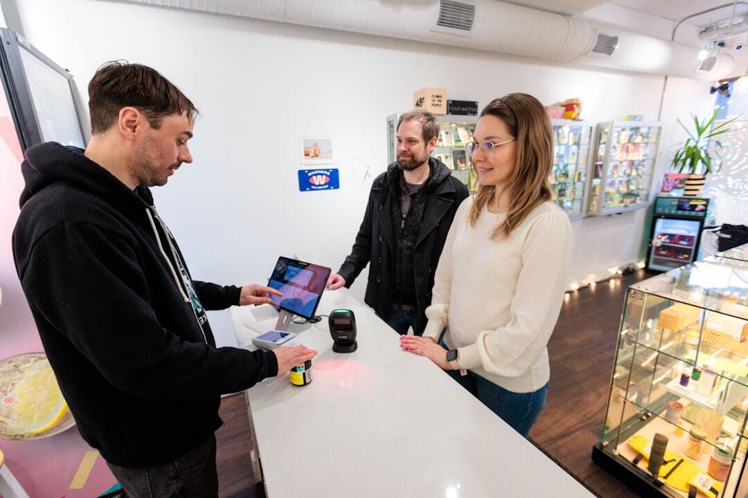Customers buying items at a cannabis shop