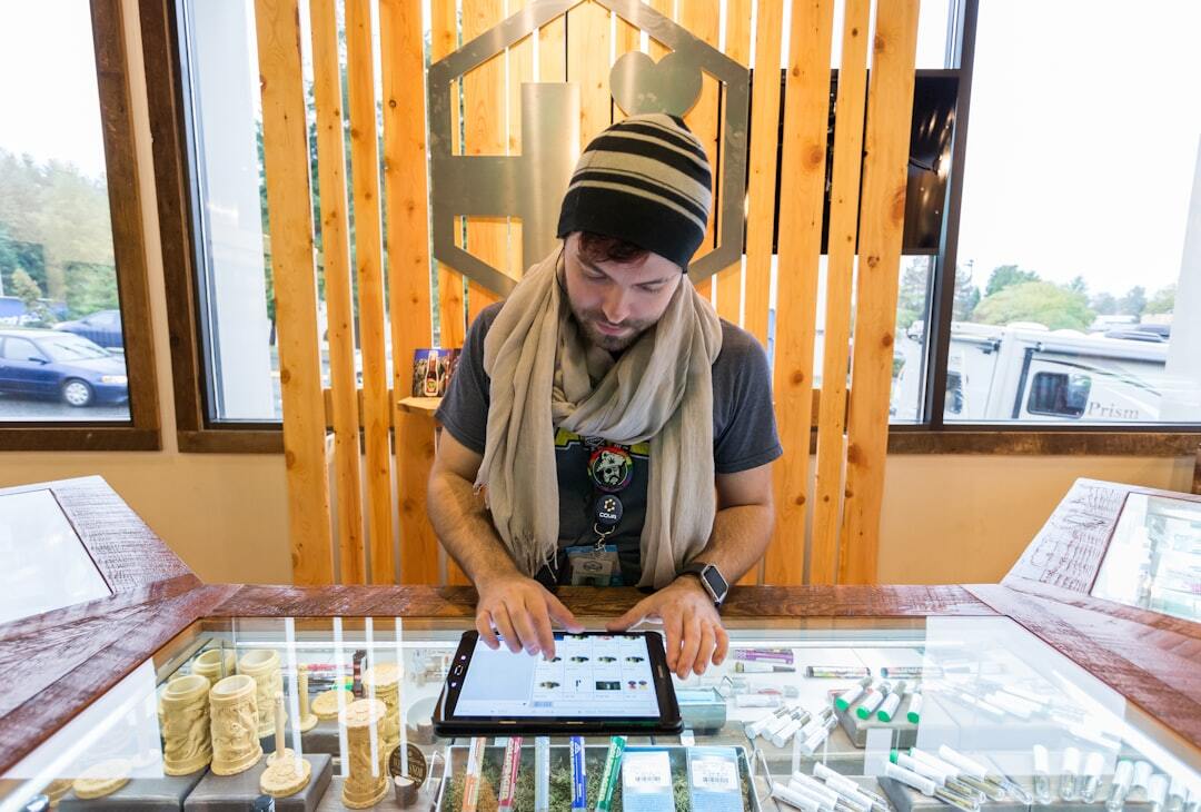 Man using tablet in a retail store
