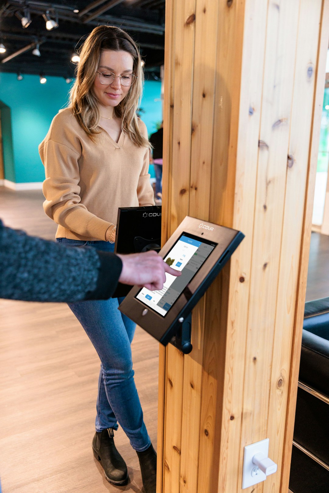 Person using interactive digital display kiosk