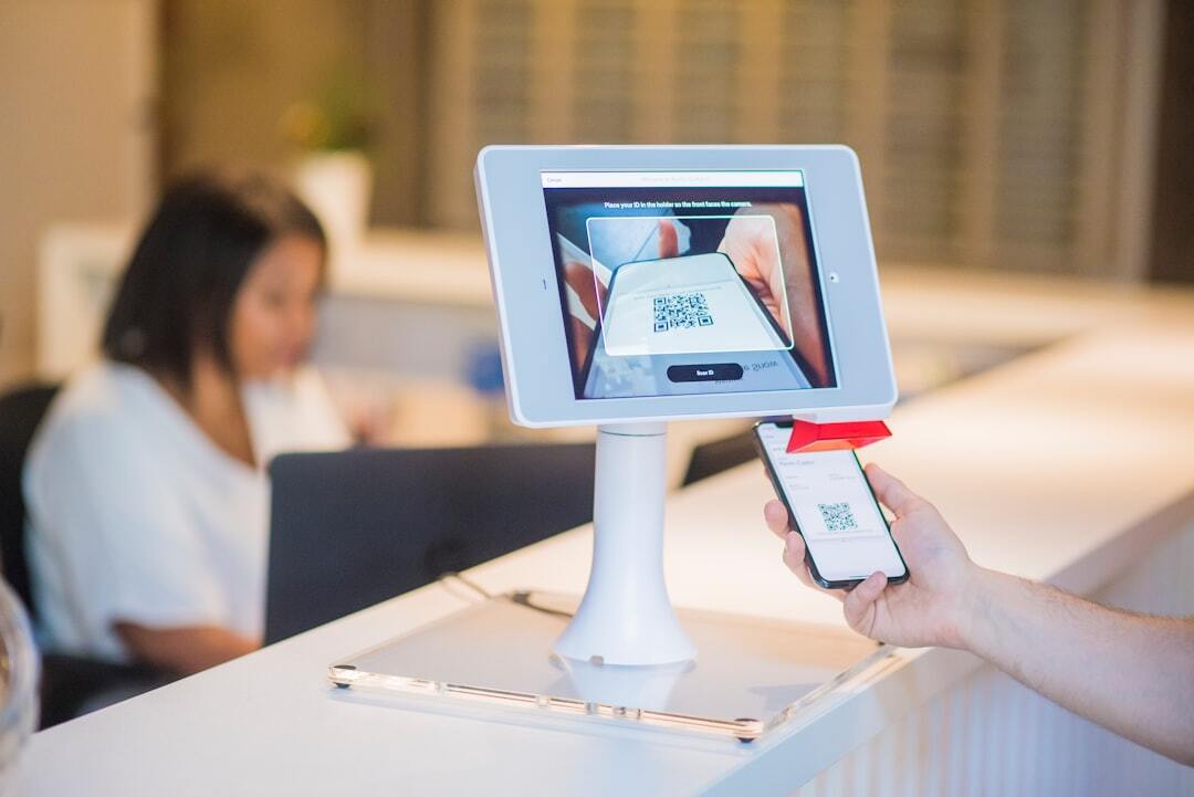 QR code scanning on tablet at dispensary reception desk
