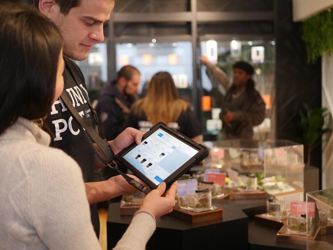 Store employees using tablet for inventory management
