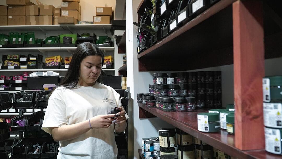 Woman organizing products in storage room