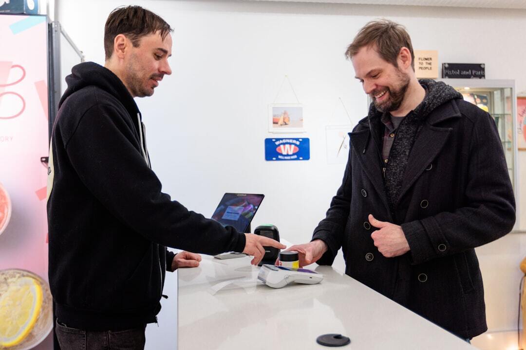 Men shopping with modern payment terminal